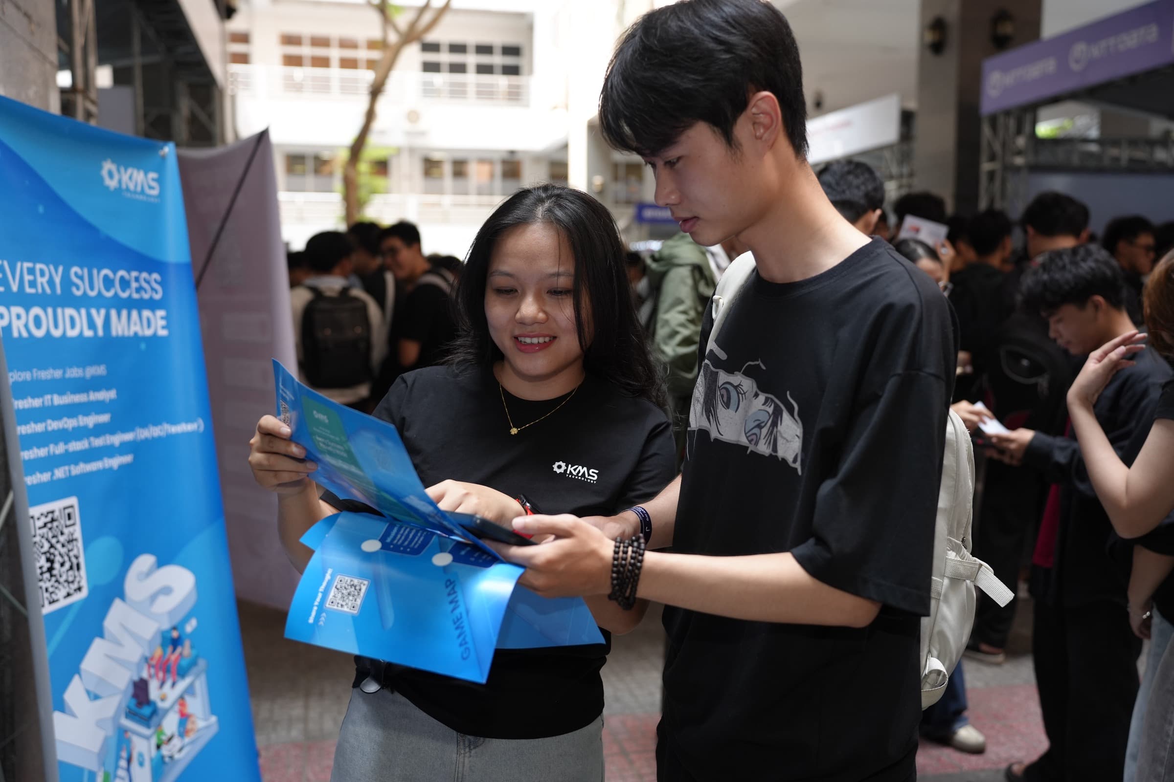 Visitors at a DevDay 2026 booth